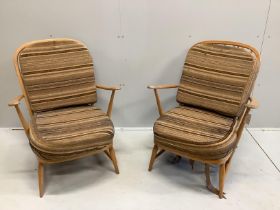 A pair of Ercol beech armchairs, width 70cm, depth 78cm, height 86cm