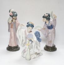 Three Lladro figures, Mirror Mirror, and two Japanese Geisha girls holding fans, (one boxed) tallest