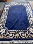 An Indian blue ground rug, 250 x 170cm