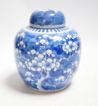 An early 20th century Chinese blue and white prunus jar and cover, 14cm
