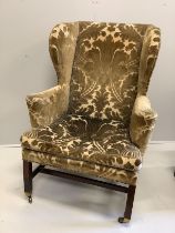 A George III mahogany velvet brocade wingback armchair, for use by Edward VII, width 84cm, depth