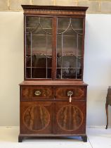 A George III satinwood banded mahogany secretaire bookcase, width 117cm, depth 58cm, height 236cm (