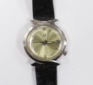 A gentleman's stainless steel Bulova Accutron wrist watch, with pale yellow dial, on Accutron strap,