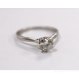 A white metal (stamped plat) and solitaire diamond set ring, size L/M, gross weight 3.5 grams, the