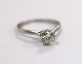 A white metal (stamped plat) and solitaire diamond set ring, size L/M, gross weight 3.5 grams, the