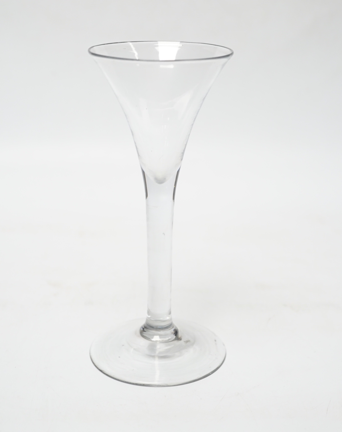A 1760-1820 Georgian trumpet wine glass, 16.5 cm high