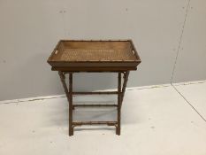 A Regency style caned faux bamboo butler’s tray on folding stand, width 61cm, depth 43cm, height