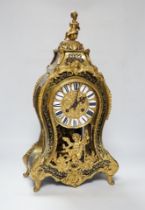 A large Louis XV style cut brass inlaid mantel clock, with a two train, French movement, striking on