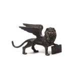 * * A Grand Tour miniature bronze Winged Lion of St. Mark, late 18th century, 7.5cm wide