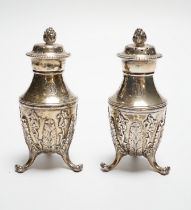 A pair of late 19th century Tiffany & Co sterling pepperettes, on tripod supports, 9cm, 157 grams.