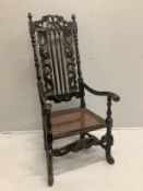 A 17th century and later walnut cane seat high back elbow chair, width 62cm, depth 53cm, height