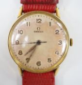 A gentleman's late 1940's gold plated Omega manual wind wrist watch, on associated leather strap,