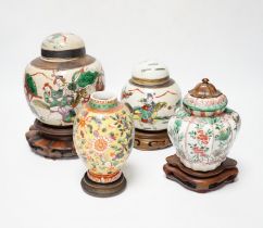 A Chinese famille verte vase, Kangxi period (cut down) and three Chinese polychrome jars with