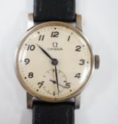 A gentleman's stainless steel Omega manual wind wrist watch, with subsidiary seconds, on later