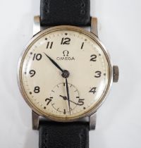 A gentleman's stainless steel Omega manual wind wrist watch, with subsidiary seconds, on later