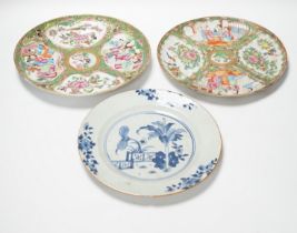 Two 19th century Chinese famille rose plates and an 18th century blue and white plate, 24cm in