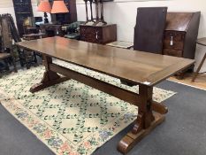 An 18th century style rectangular oak refectory style dining table, length 244cm, width 76cm, height