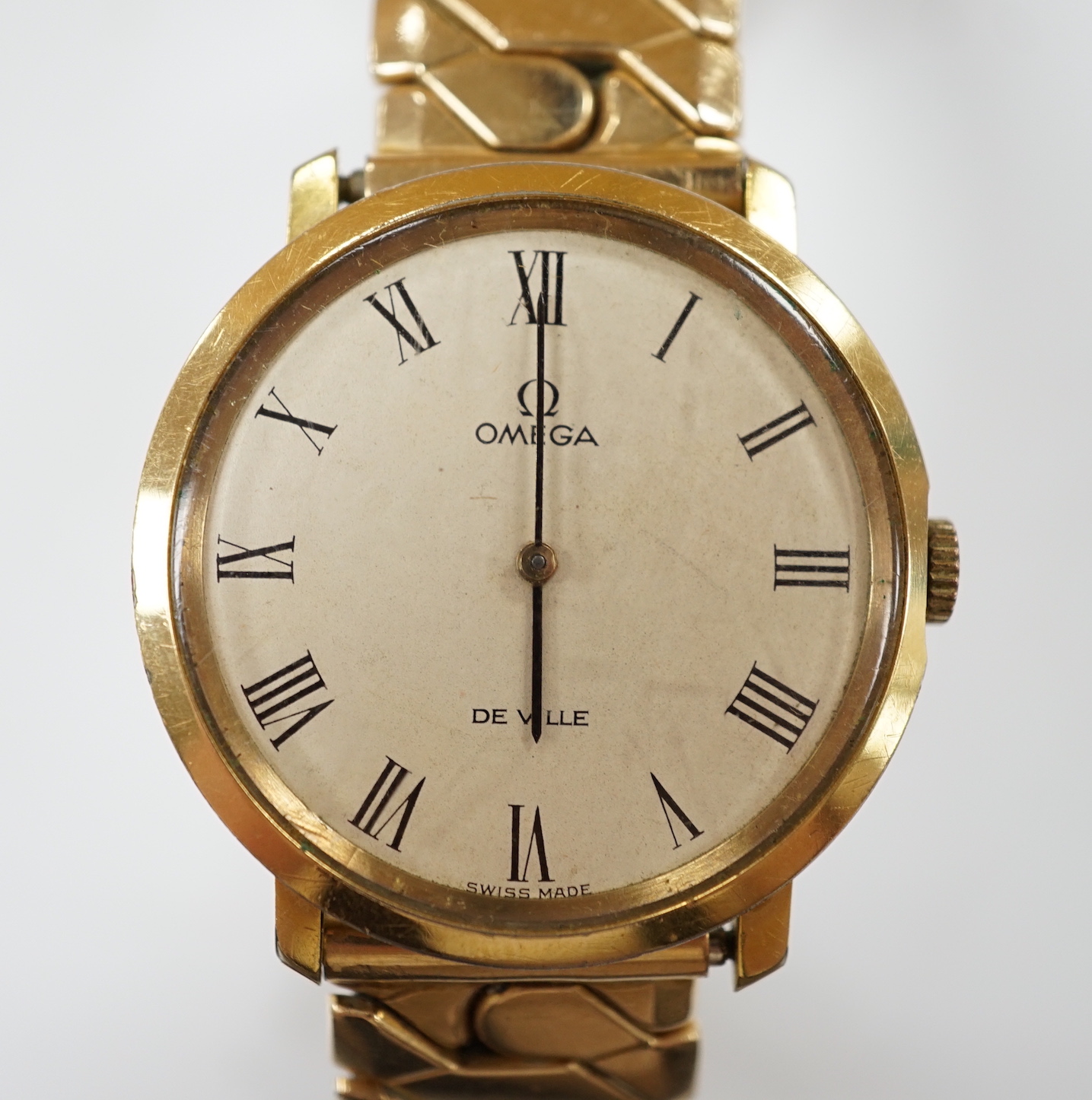 A gentleman's steel and gold plated Omega De Ville manual wind wrist watch, on associated flexible