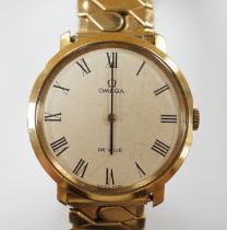 A gentleman's steel and gold plated Omega De Ville manual wind wrist watch, on associated flexible