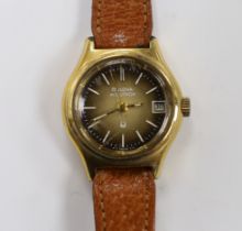 A lady's steel and gold plated Bulova Accutron wrist watch, on a leather strap.