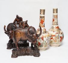 A pair of Japanese Satsuma vases and a pair of Chinese carved figural ox groups, carvings 25cm high