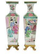 A pair of Chinese famille rose square baluster vases, late 19th/early 20th century, with European