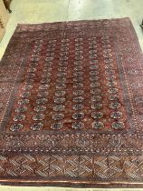 A Bokhara red ground carpet,310 x 237cm
