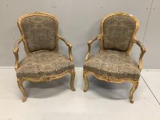 A pair of Louis XVI style giltwood and composition fauteuils, width 61cm, depth 52cm, height 86cm