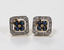 A modern pair of 375 yellow metal, sapphire and diamond chip set square cluster earrings, one