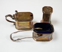 A George V silver three piece condiment set by S.W. Smith & Co, Birmingham, 1917/8/9 and a pair of