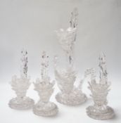 A set of four glass stylistic floral candlesticks, (one double holder the other three single