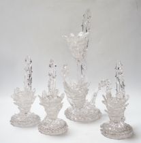 A set of four glass stylistic floral candlesticks, (one double holder the other three single