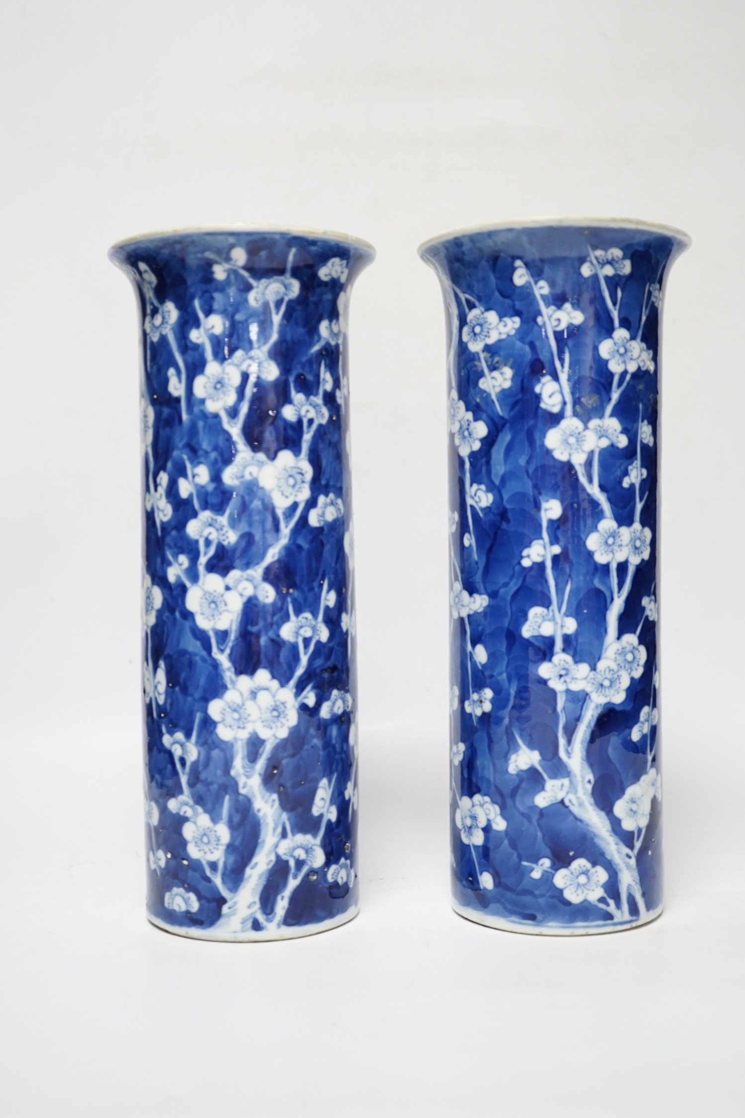 A pair of Chinese blue and white prunus flower sleeve vases, c.1900, (restored), 26cm high - Image 3 of 5