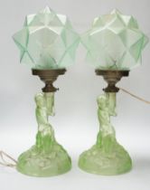 A pair of Art Deco press glass figural table lamps, 40cm