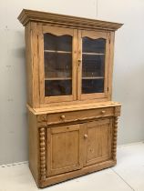 A 19th century Continental glazed pine kitchen cabinet, width 114cm, depth 50cm, height 186cm