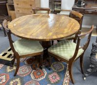 A Regency circular rosewood tilt top breakfast table, diameter 121cm, height 71cm together with four