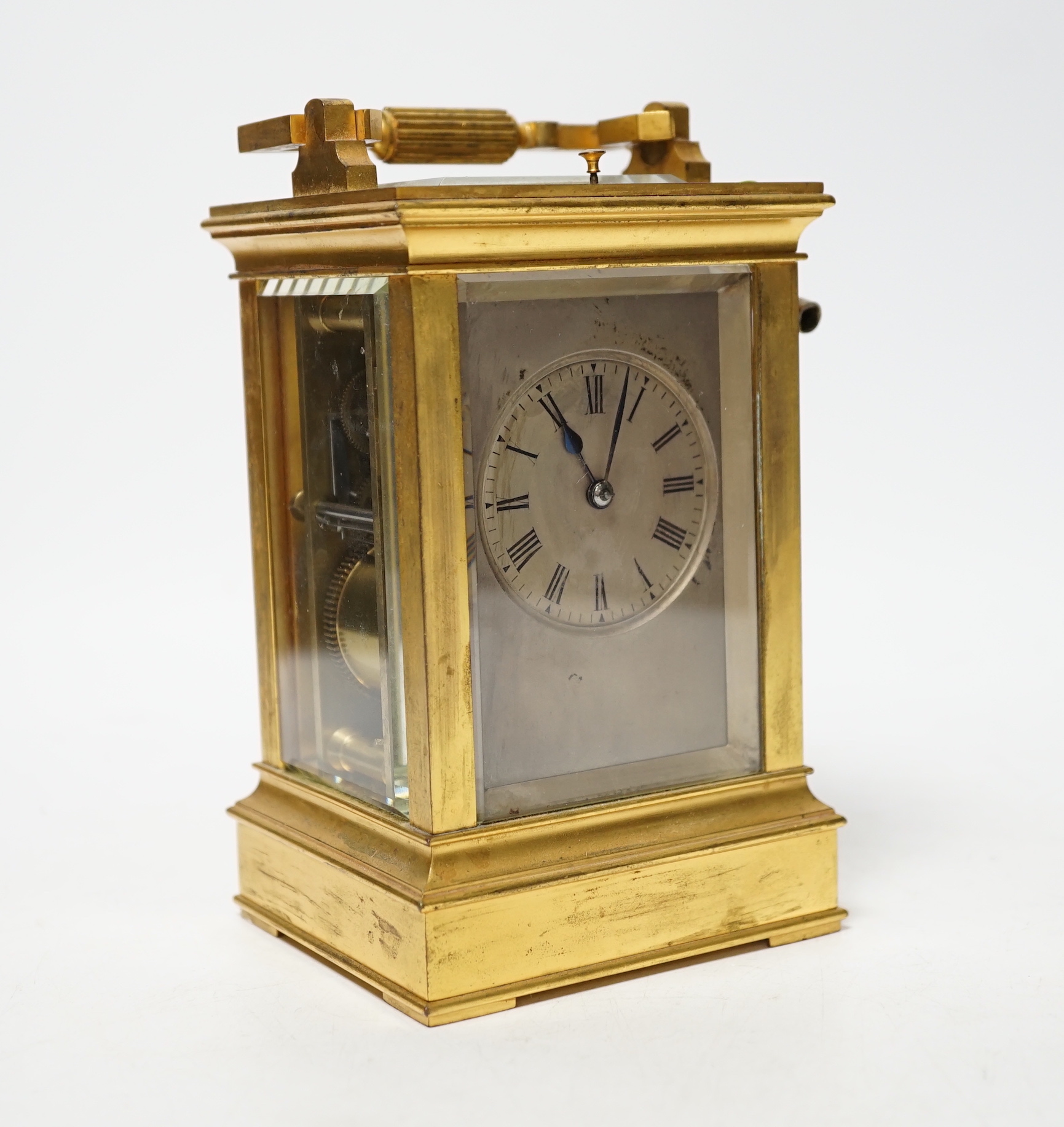 ** ** A late 19th century French gilt brass cased eight day repeating carriage clock with key,