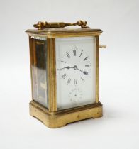 A brass carriage clock with subsidiary dial, 16cm high