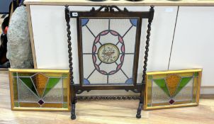 An early 20th century stained glass oak firescreen, height 84cm together with a pair of Art Deco