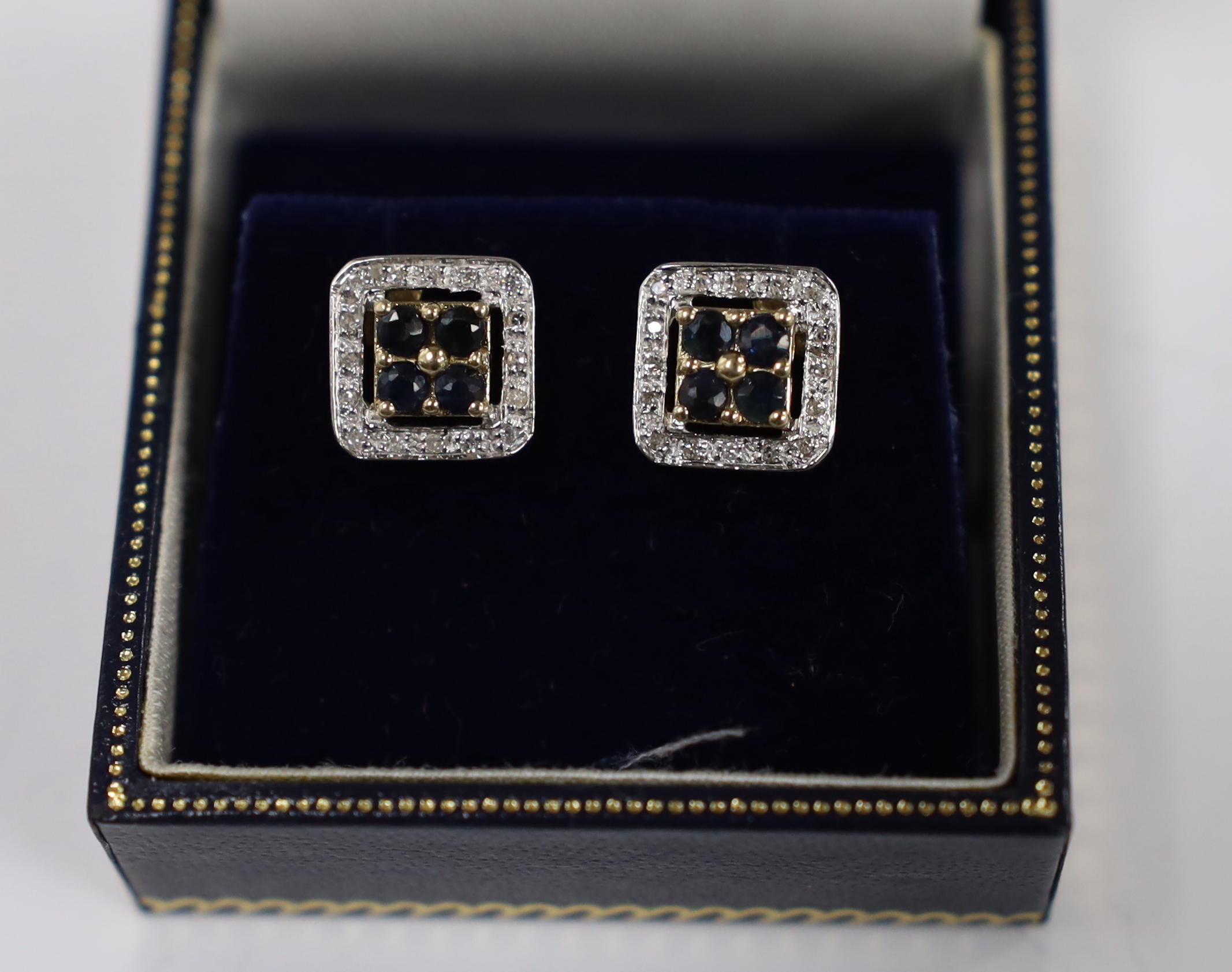 A modern pair of 375 yellow metal, sapphire and diamond chip set square cluster earrings, one - Image 3 of 3