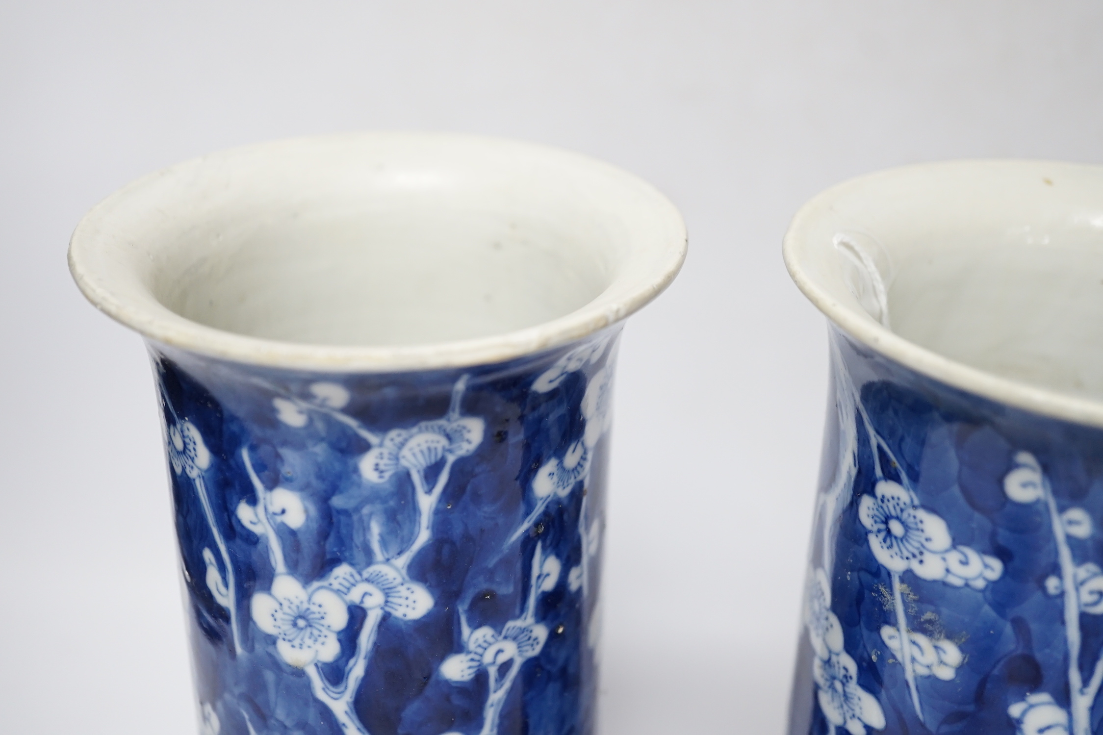 A pair of Chinese blue and white prunus flower sleeve vases, c.1900, (restored), 26cm high - Image 4 of 5