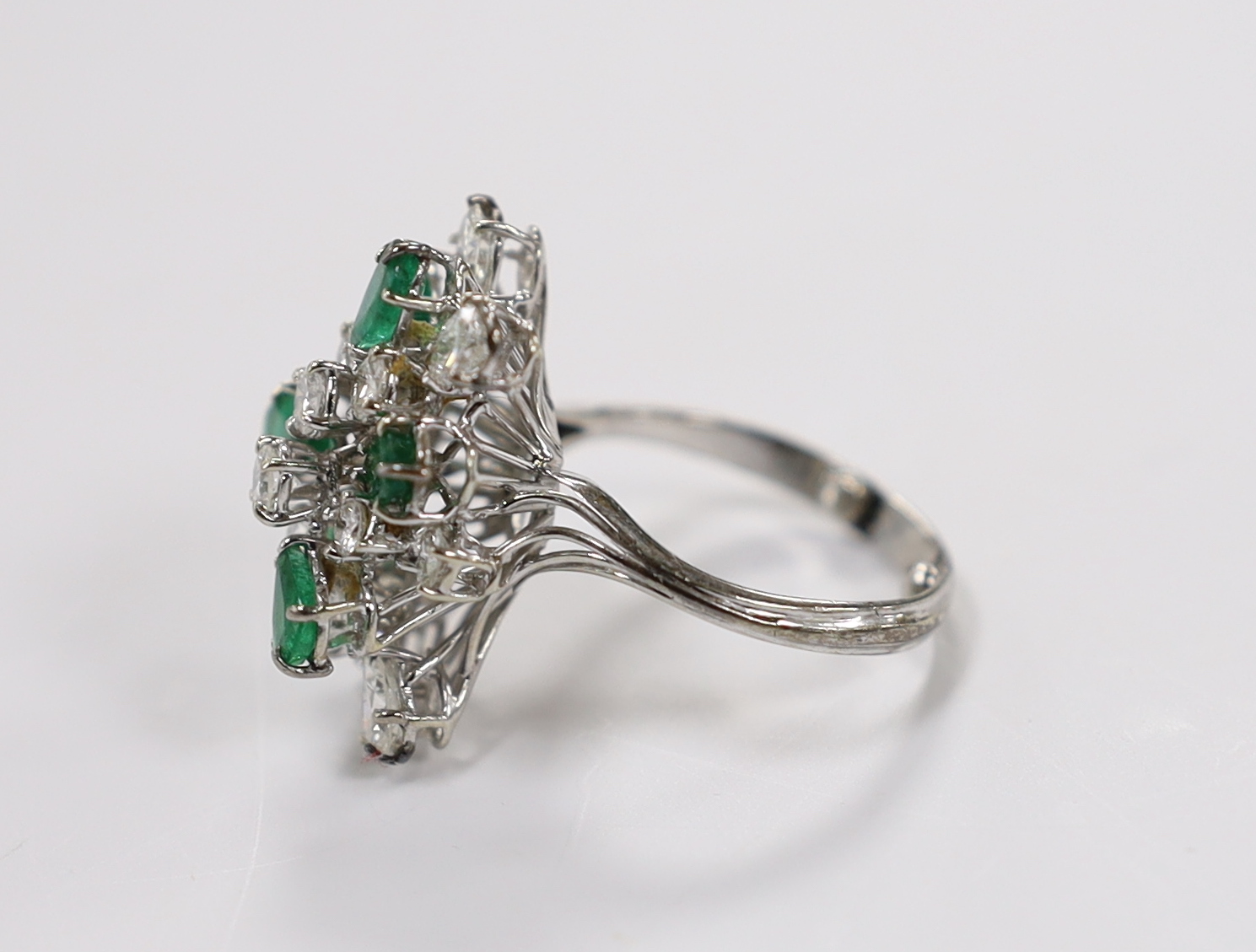 A modern white metal emerald and diamond cluster set dress ring, size R/S, the shank with two sizing - Image 2 of 3
