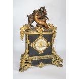 An early 20th century gilt-metal mounted mantel clock with bacchanalian group surmount, 44cm