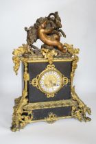 An early 20th century gilt-metal mounted mantel clock with bacchanalian group surmount, 44cm