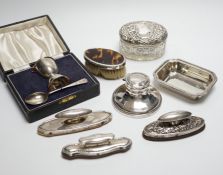 A cased silver christening egg cup and spoons and other items including nail buffers, inkwell,