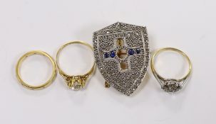 A late 19th century yellow metal, rose cut diamond and sapphire cluster set shield shaped brooch (
