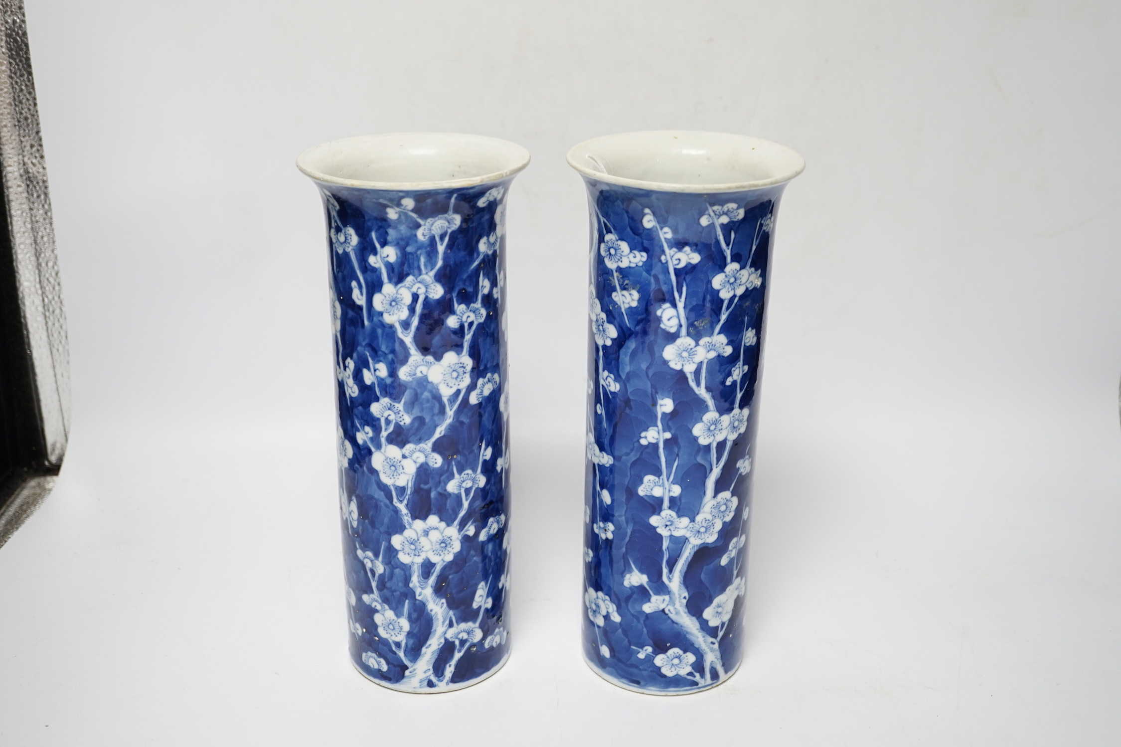 A pair of Chinese blue and white prunus flower sleeve vases, c.1900, (restored), 26cm high - Image 2 of 5