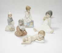 Five Lladro figures; two angelic, two nativity, one of a sleeping child and another of a girl with a