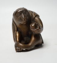 A Japanese bronze model of a monkey, 19th century, 5.5cm high