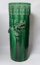 An early 20th century Japanese green glazed ‘dragon’ stick stand, 61cm